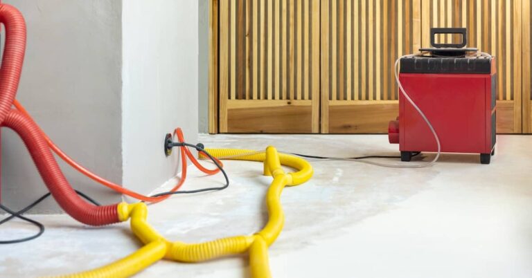 Dehumidifier in home with water damage | ATI Restoration