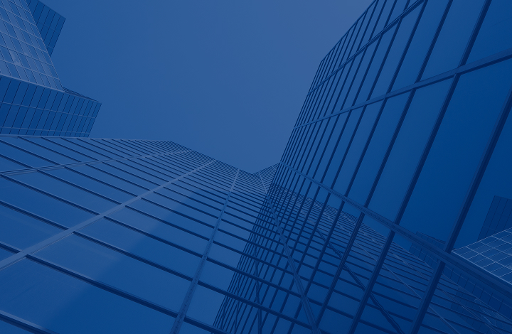 Low-angle view of modern glass skyscrapers.