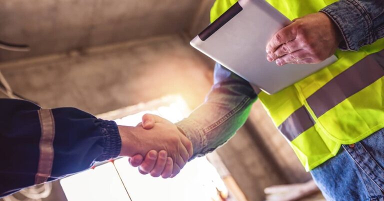 Restoration company representatives shaking hands with client | ATI Restoration